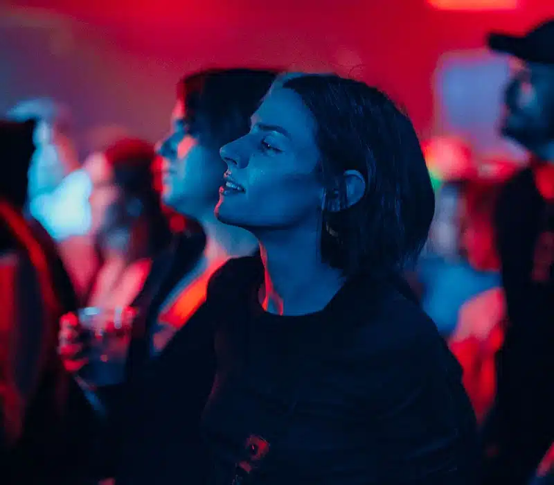 woman in glow concert
